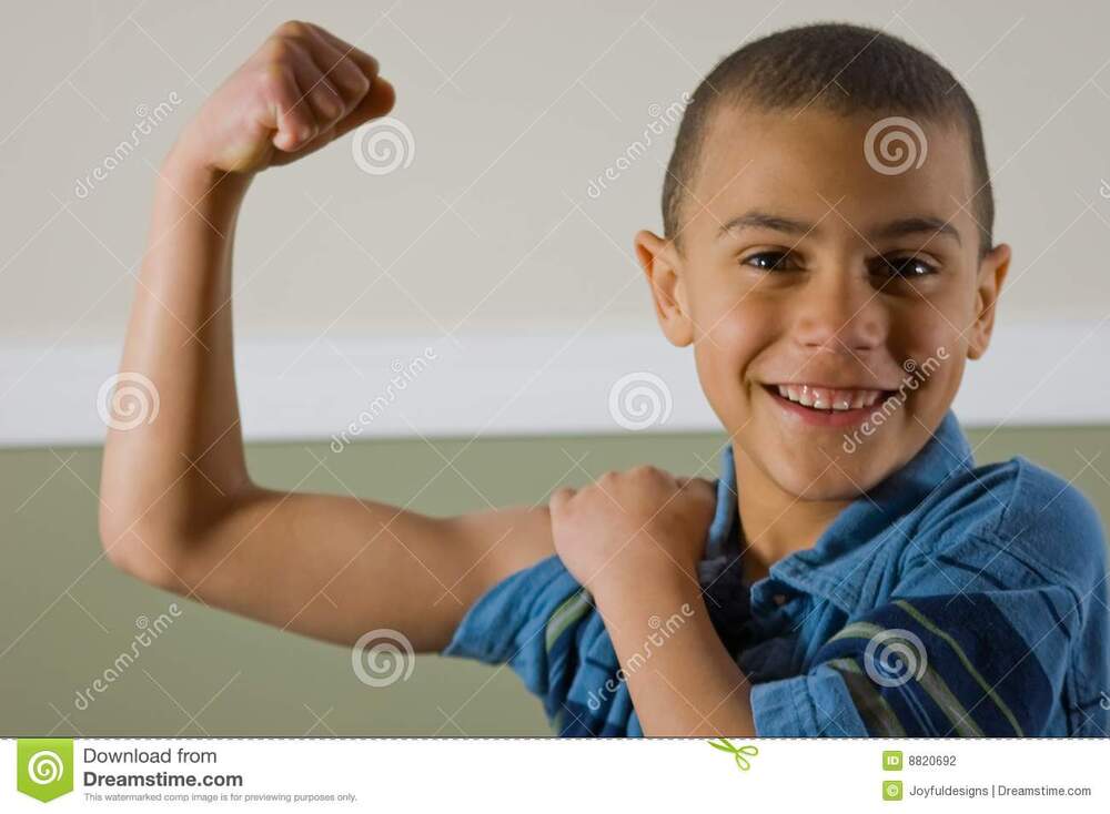 9-year-old-boy-showing-off-his-muscles-8820692.jpg