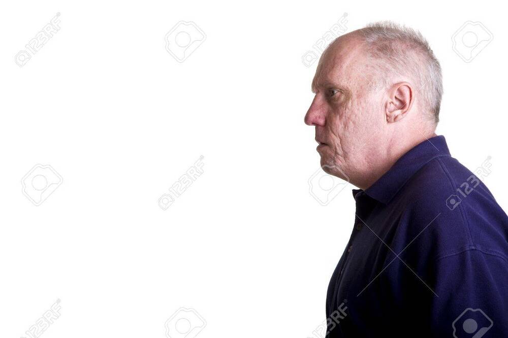 -an-older-bald-guy-looking-to-right-into-copyspace.jpg