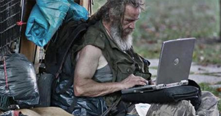 homelessmanonlaptop.png