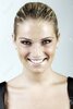 24369984-beautiful-blond-woman-with-her-hair-tied-back-neatlf.jpg