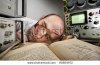 stock-photo-exhausted-scientist-sleeping-on-book-at-vintage-technological-laboratory-80809972.jpg
