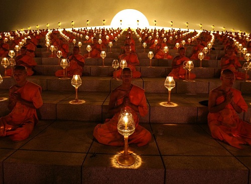 Thousands-of-Thai-Buddhist-monks-chant-during-a-lantern-lighting-to-celebrate-Makha-Bucha-day-at-Dhammakaya-Temple-in-Pathum-Thani-province-on-the-outskirts-of-Bangkok.jpg